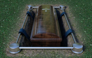 Modern Coffin Into Grave